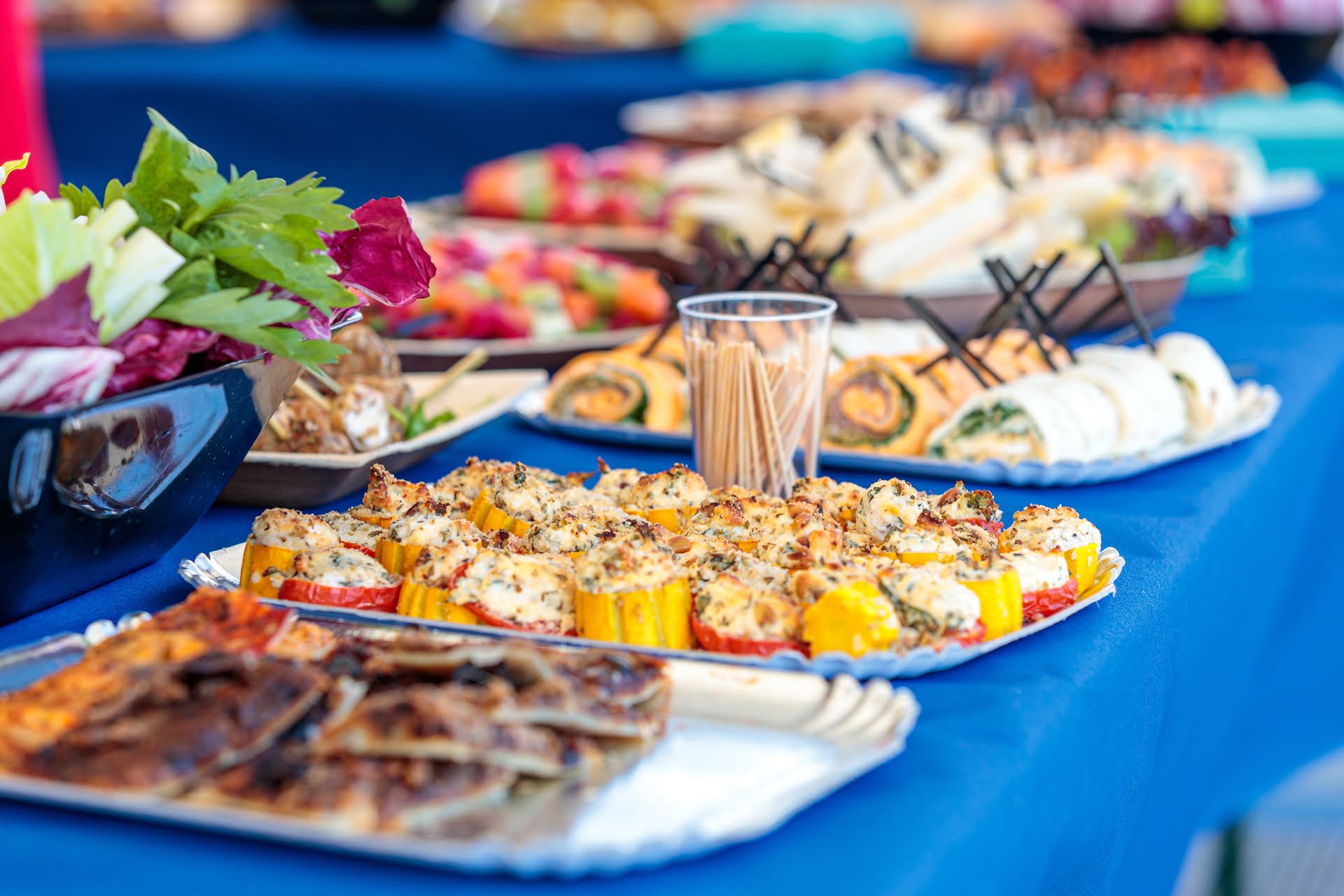 High angle shot of delicious desserts and appetizers on a table in a yacht