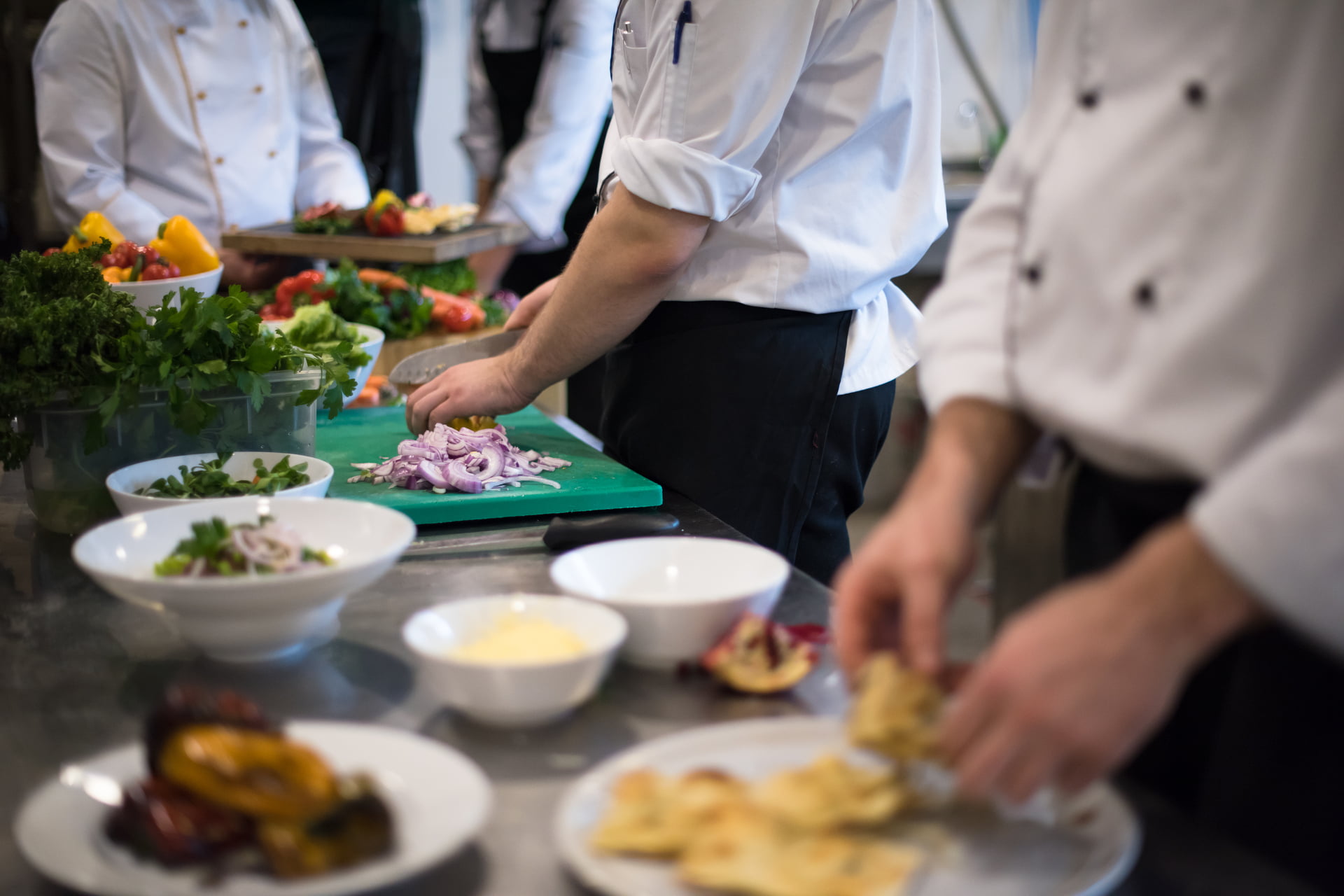 team cooks and chefs preparing meal
