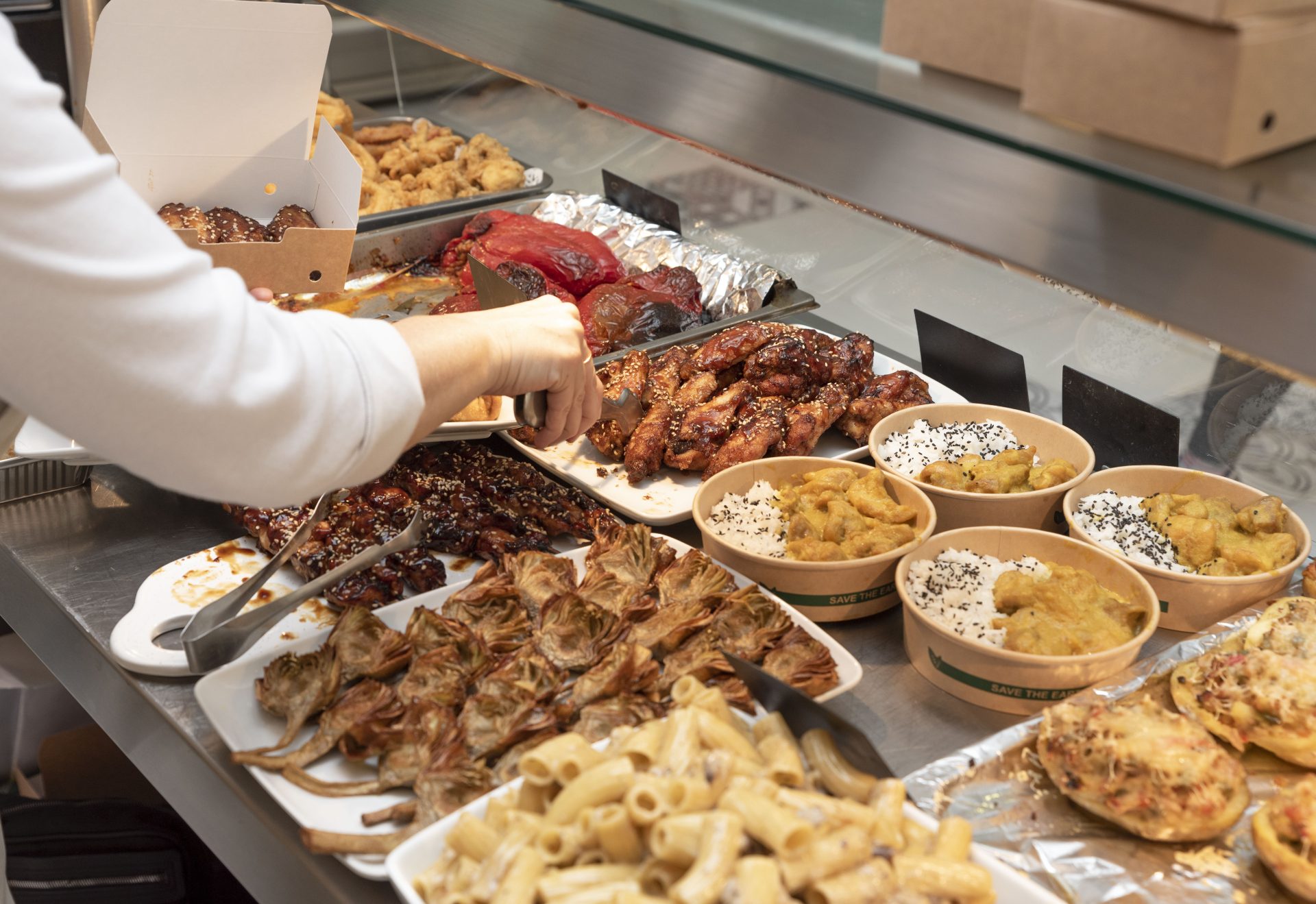 the-hand-of-an-unrecognizable-person-putting-chick-2023-11-27-05-11-11-utc